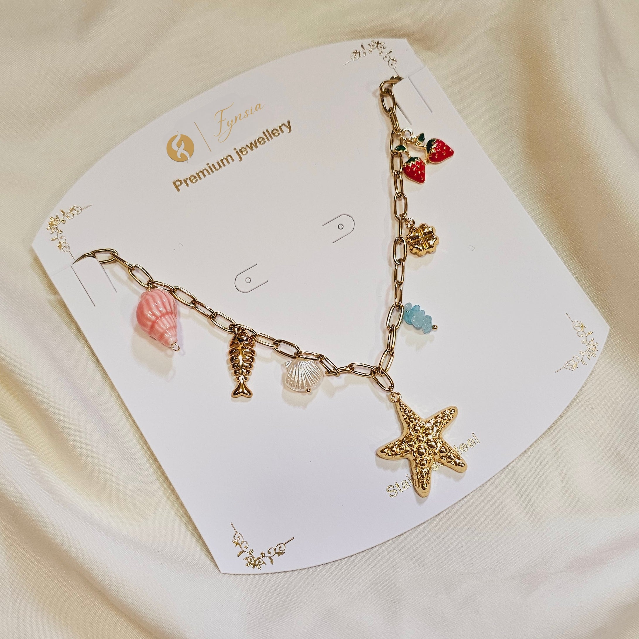 Naira Seashell Charm Neckchain – 18K Gold Tone Stainless Steel | Fynsia