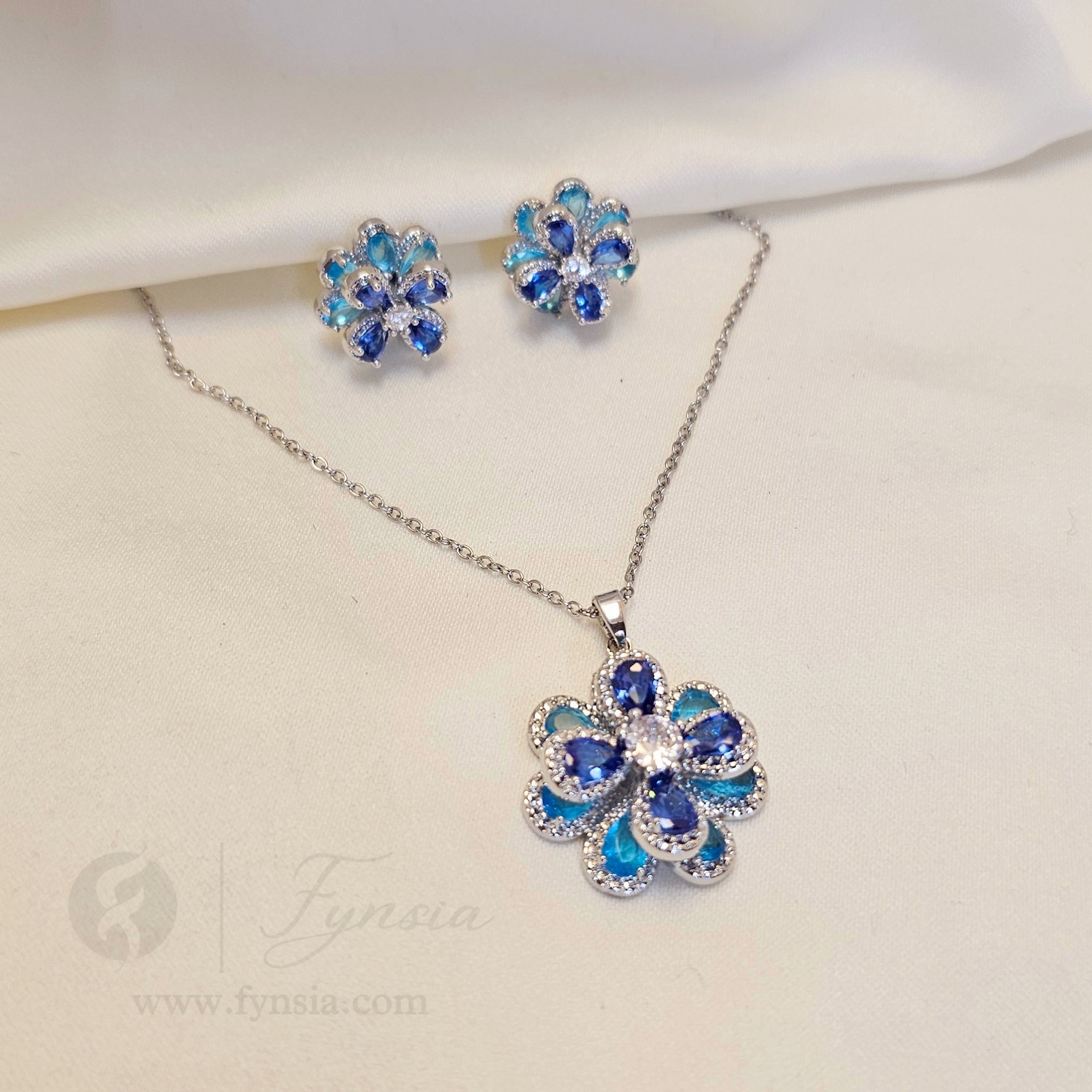 Tushita Zirconia Aqua Blue Silver Tone Pendant Chain Set With Earrings | Fynsia