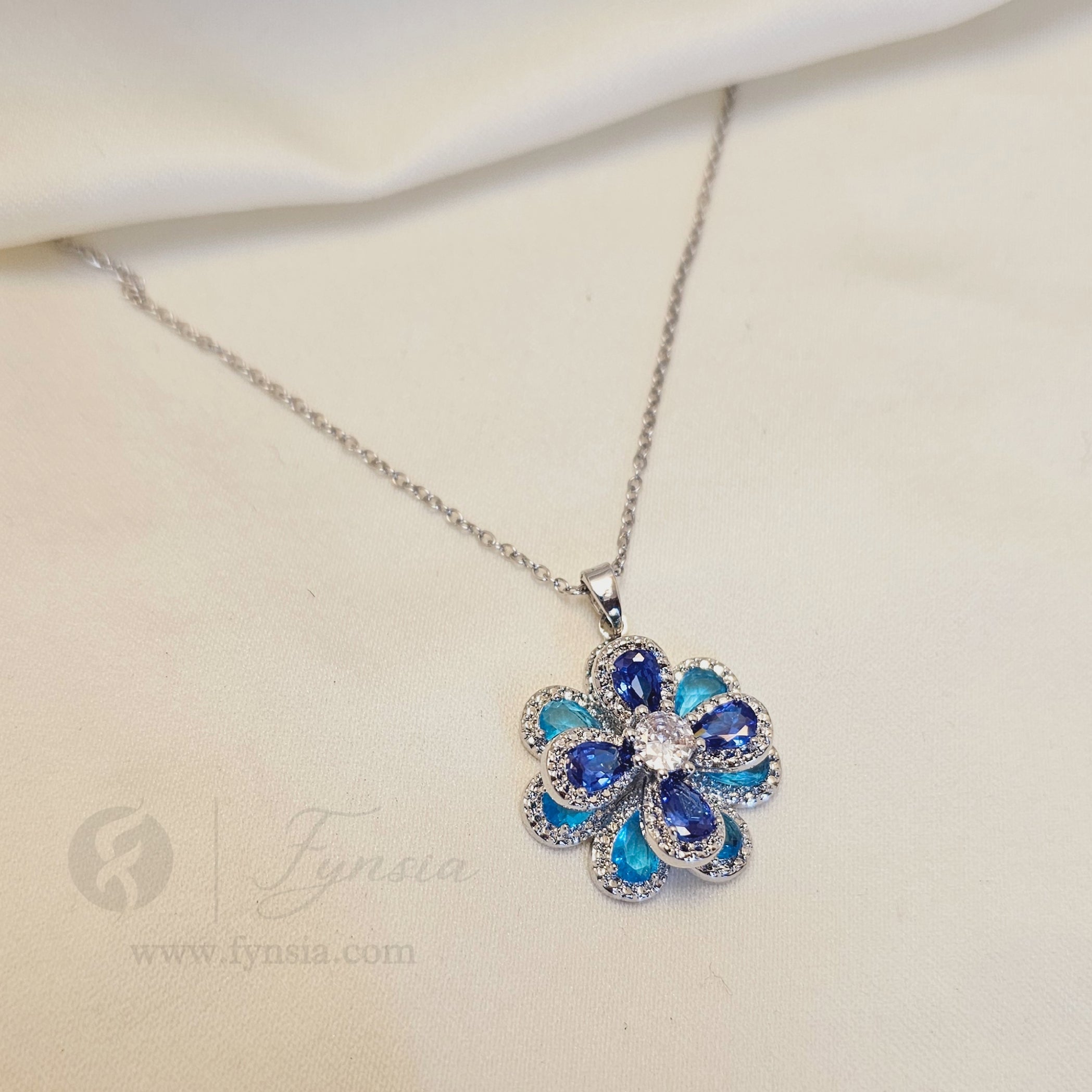 Tushita Zirconia Aqua Blue Silver Tone Pendant Chain Set With Earrings | Fynsia