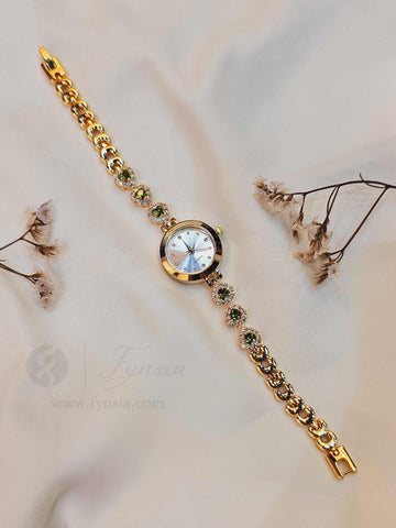 Rasleen Golden White Round Dial Zirconia Green Stone Belt Women's Watch | Fynsia