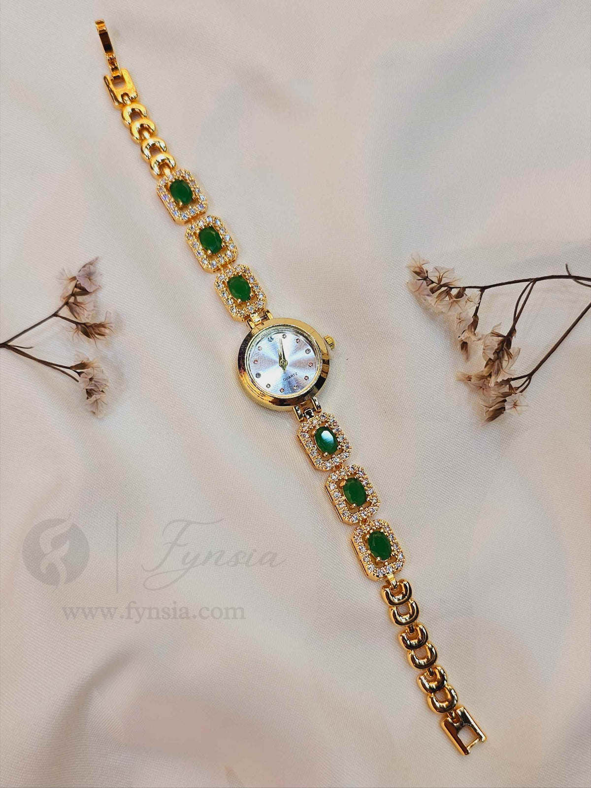 Snehil Golden White Round Dial Zirconia Green Stone Belt Women's Watch | Fynsia