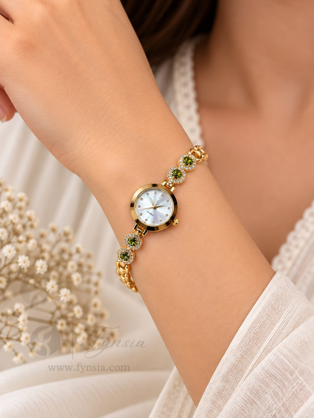 Rasleen Golden White Round Dial Zirconia Green Stone Belt Women's Watch | Fynsia