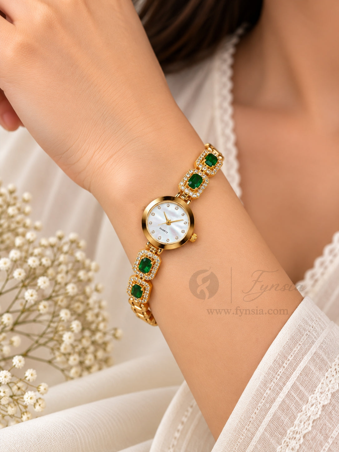 Snehil Golden White Round Dial Zirconia Green Stone Belt Women's Watch | Fynsia